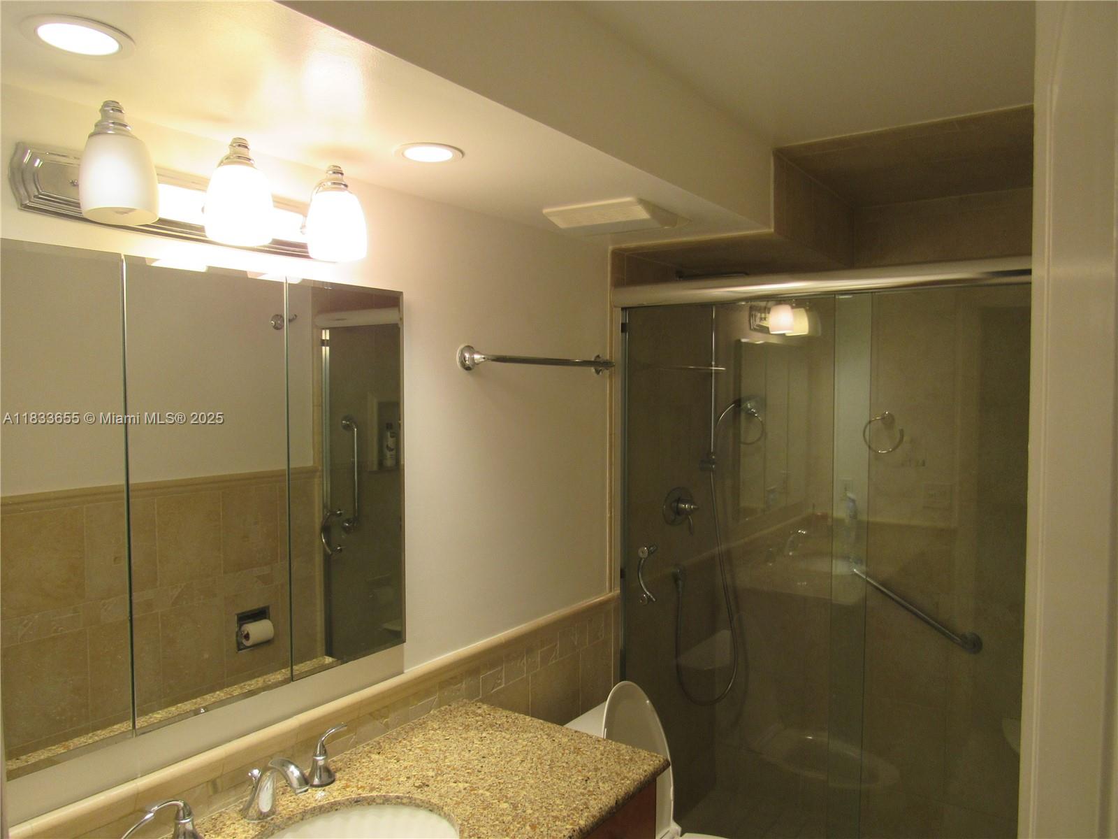 1101 River Reach Drive, Unit 418 Fort Lauderdale, FL 33315 - Photo 17 of 54 a bathroom with a shower and a sink