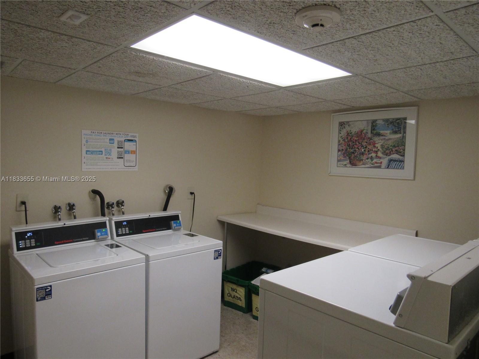 1101 River Reach Drive, Unit 418 Fort Lauderdale, FL 33315 - Photo 20 of 54 a utility room with dryer and washer
