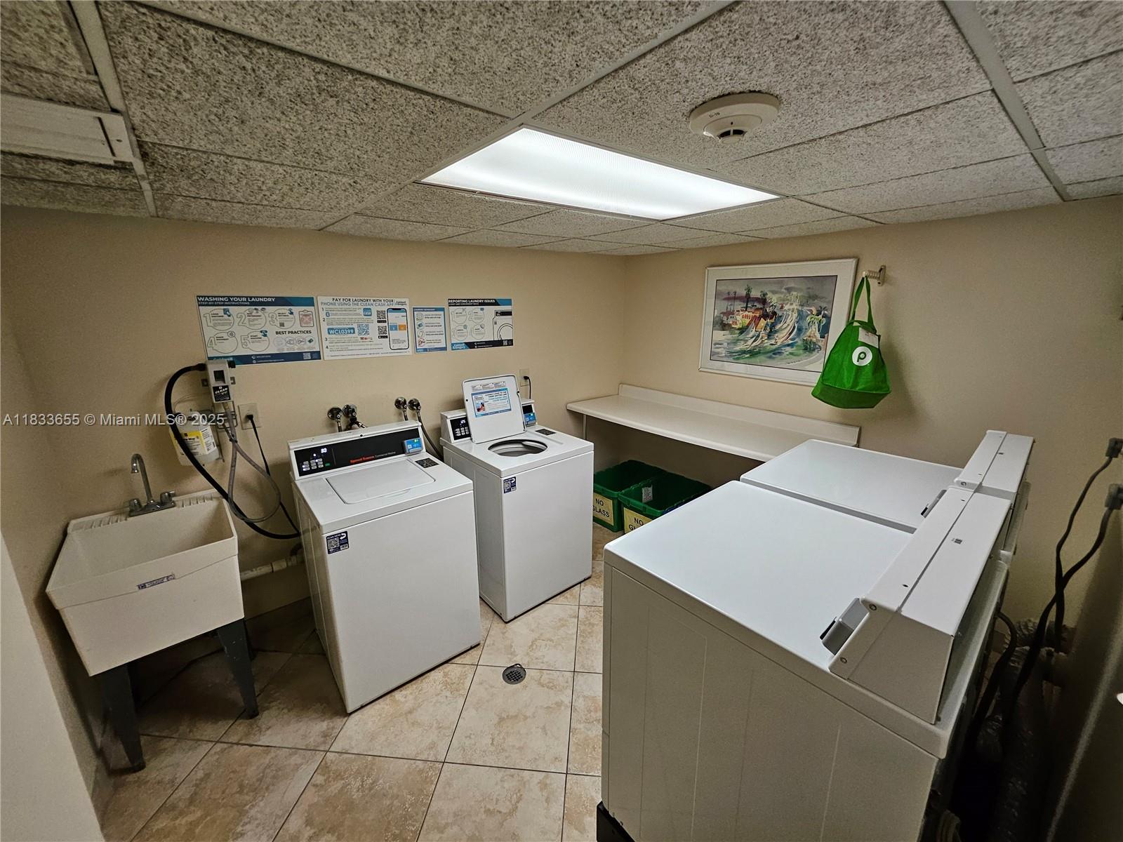 1101 River Reach Drive, Unit 418 Fort Lauderdale, FL 33315 - Photo 22 of 54 a utility room with dryer and washer