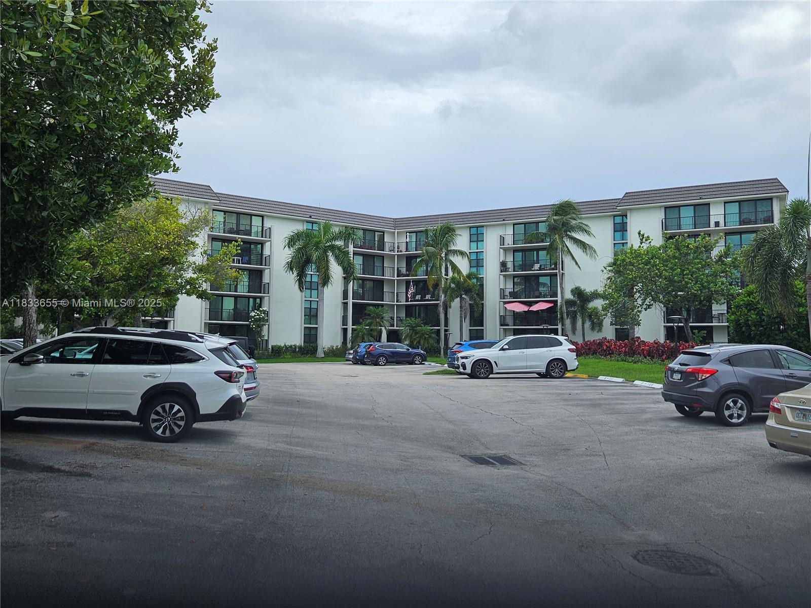 1101 River Reach Drive, Unit 418 Fort Lauderdale, FL 33315 - Photo 26 of 54 a car parked in front of a house