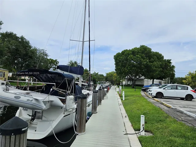 a view of cars parked in front of a house