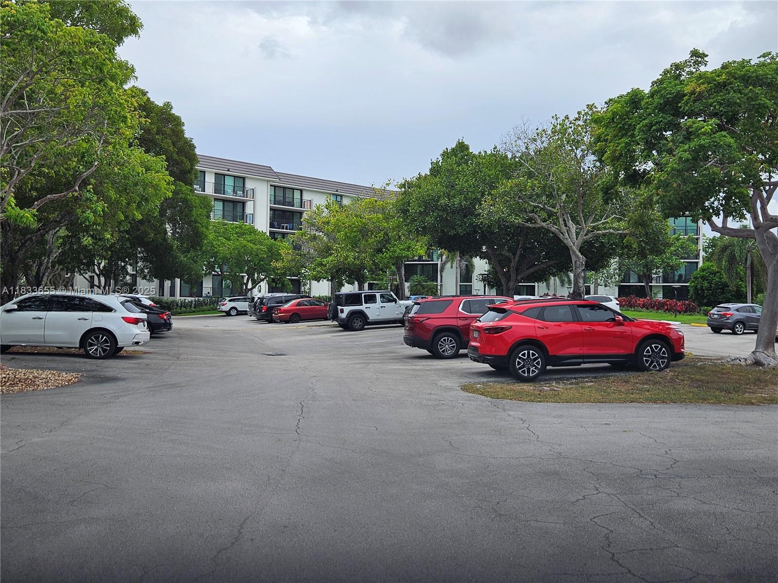 1101 River Reach Drive, Unit 418 Fort Lauderdale, FL 33315 - Photo 32 of 54 a view of cars parked in front of a house