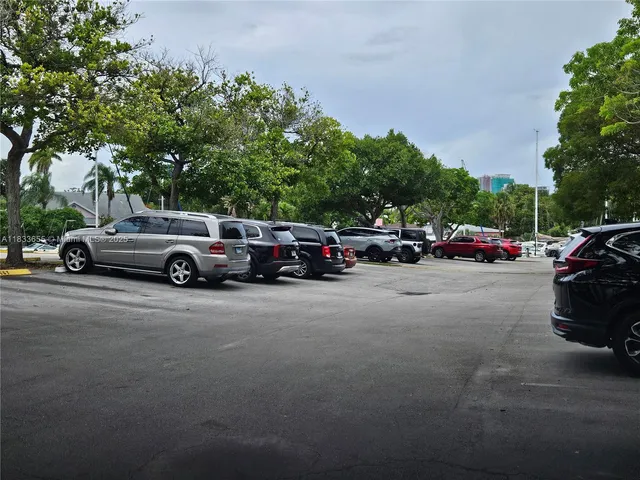 a view of a car parked in front of a house