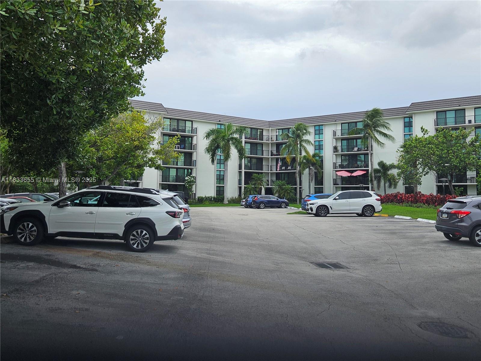 1101 River Reach Drive, Unit 418 Fort Lauderdale, FL 33315 - Photo 37 of 54 a view of a car parked in front of a house