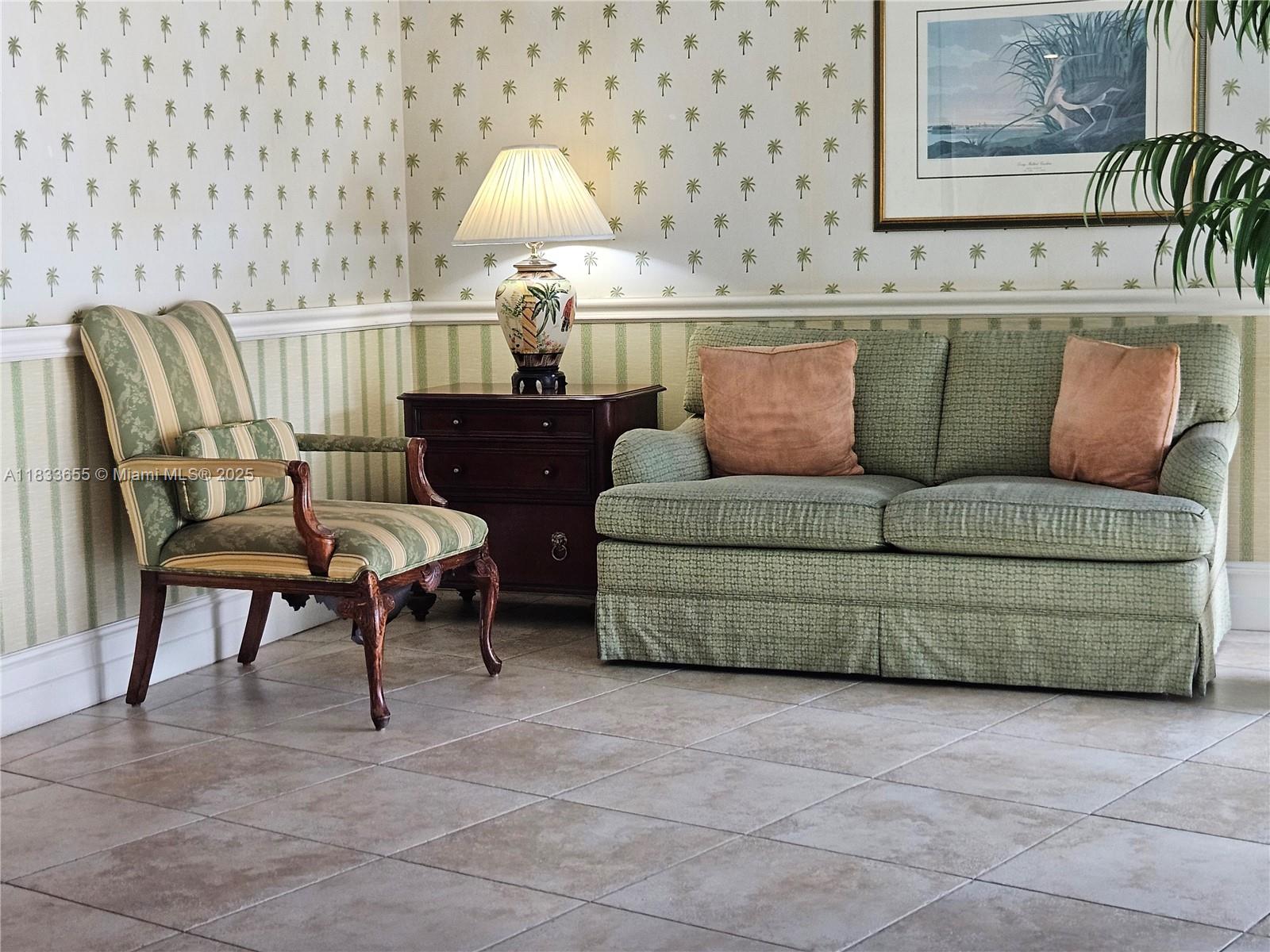 1101 River Reach Drive, Unit 418 Fort Lauderdale, FL 33315 - Photo 42 of 54 a living room with furniture and a lamp