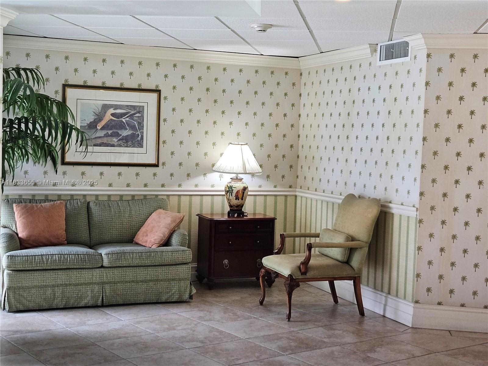 1101 River Reach Drive, Unit 418 Fort Lauderdale, FL 33315 - Photo 43 of 54 a living room with furniture and a painting on the wall