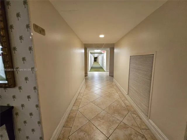 a view of a room with toys and wooden floor