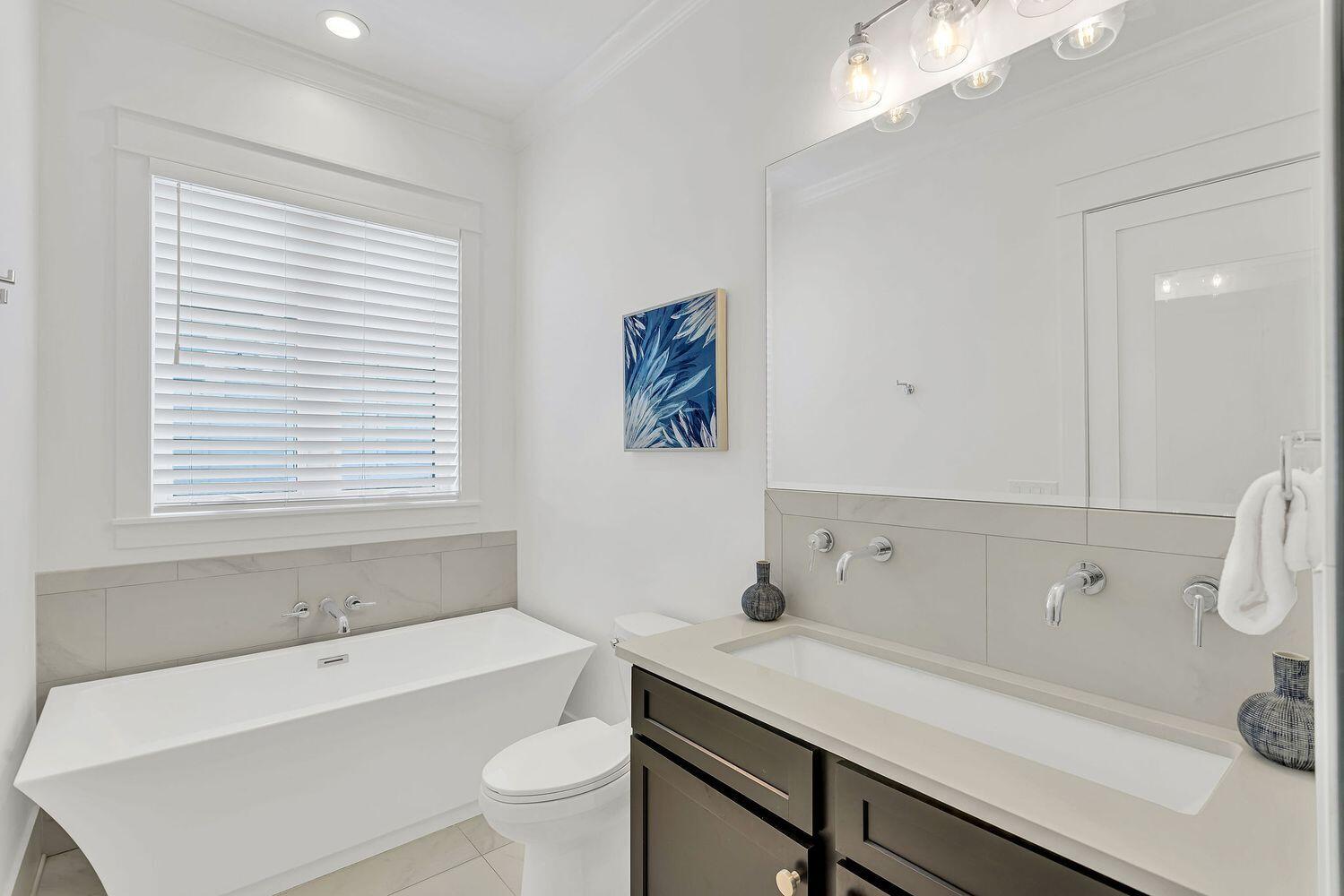 28 Hiker Street Santa Rosa Beach, FL 32459 - Photo 25 of 55 a bathroom with a sink a toilet and a bathtub