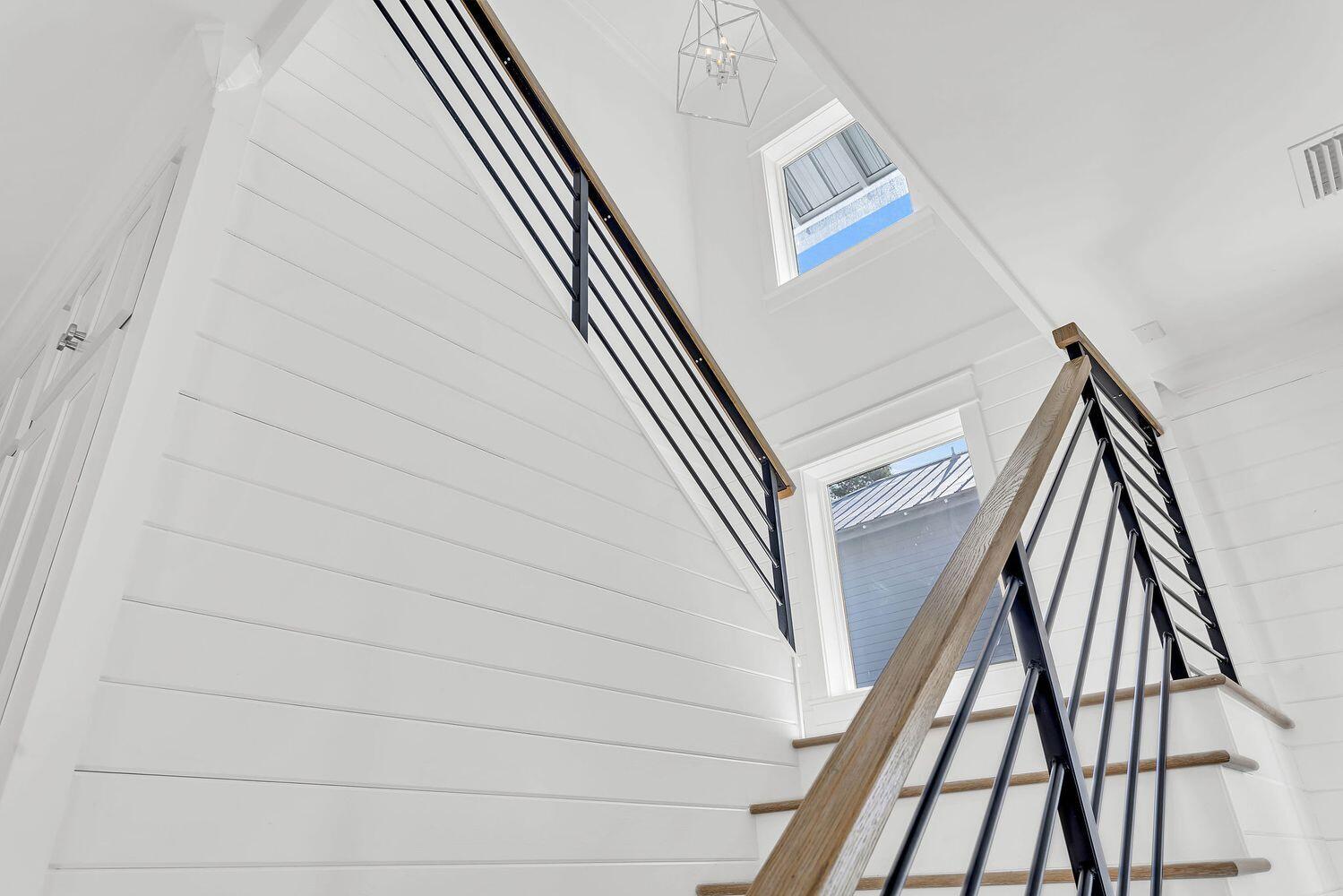 28 Hiker Street Santa Rosa Beach, FL 32459 - Photo 27 of 55 a view of staircase with wooden floor and metal railing