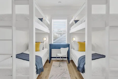 a bedroom with a bed and a table in it