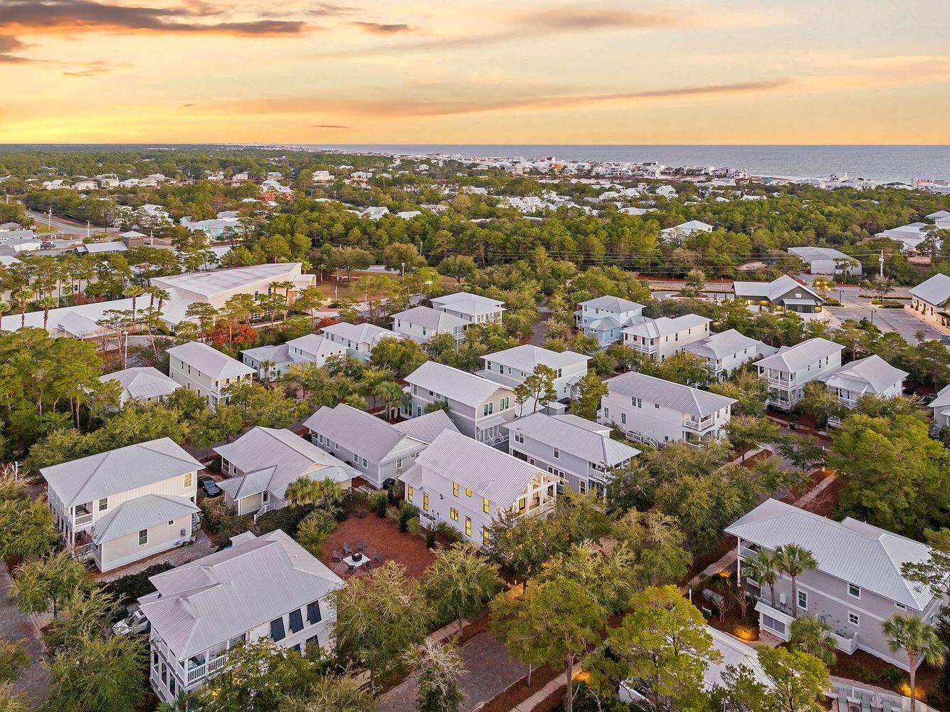 28 Hiker Street Santa Rosa Beach, FL 32459 - Photo 50 of 55 an aerial view of a city with lots of residential buildings and ocean view in back