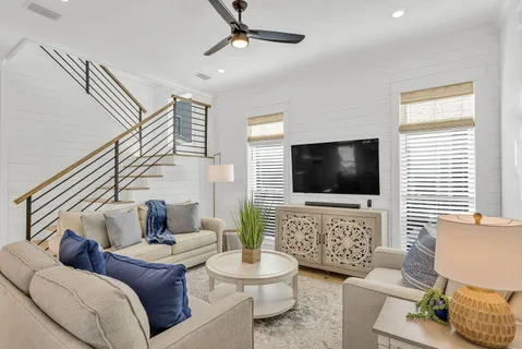 a living room with furniture and a flat screen tv