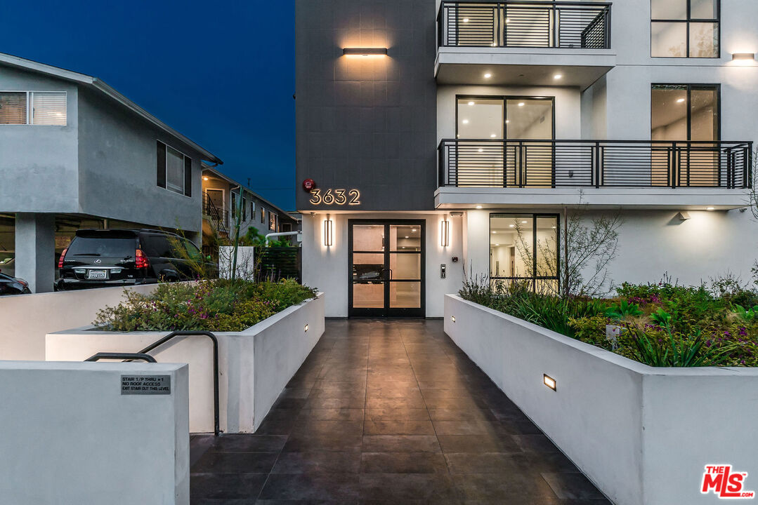 3632 Keystone Avenue, Unit 302 Los Angeles, CA 90034 - Photo 14 of 38 a view of a house with roof stairs and potted plants