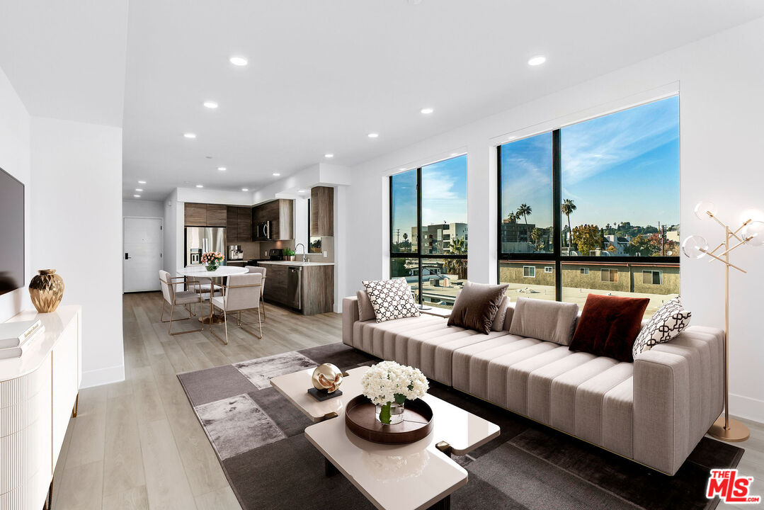 3632 Keystone Avenue, Unit 302 Los Angeles, CA 90034 - Photo 2 of 38 a living room with furniture and view of kitchen