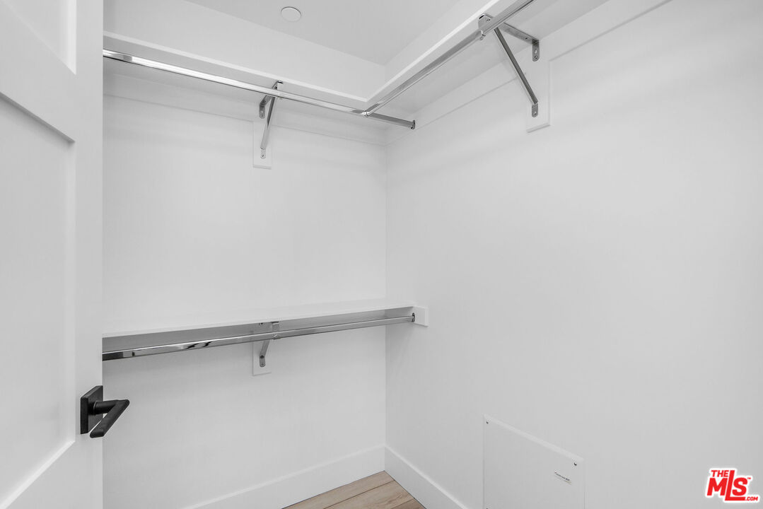 3632 Keystone Avenue, Unit 302 Los Angeles, CA 90034 - Photo 32 of 38 a view of a room with racks on the wall