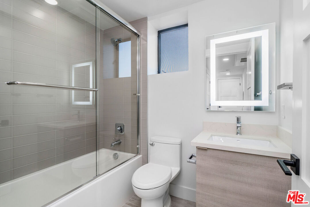 3632 Keystone Avenue, Unit 302 Los Angeles, CA 90034 - Photo 33 of 38 a bathroom with a sink toilet and shower