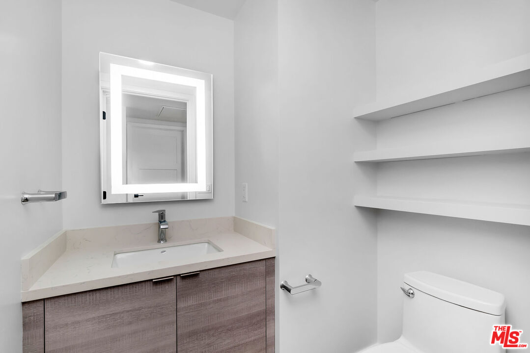 3632 Keystone Avenue, Unit 302 Los Angeles, CA 90034 - Photo 38 of 38 a bathroom with a sink and a toilet