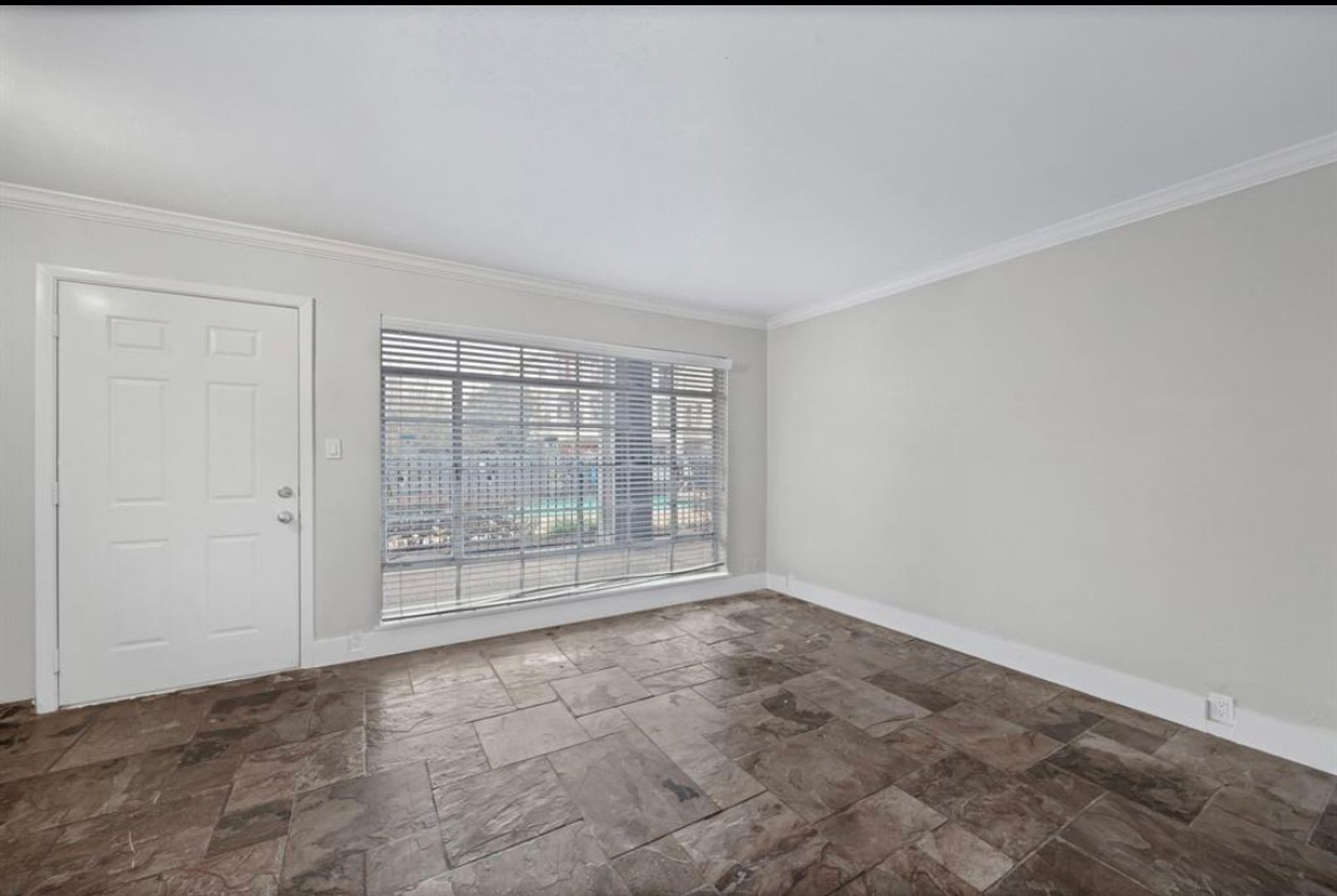 2322 Richton Street, Unit 13 Houston, TX 77098 - Photo 11 of 11 a view of an empty room with glass door