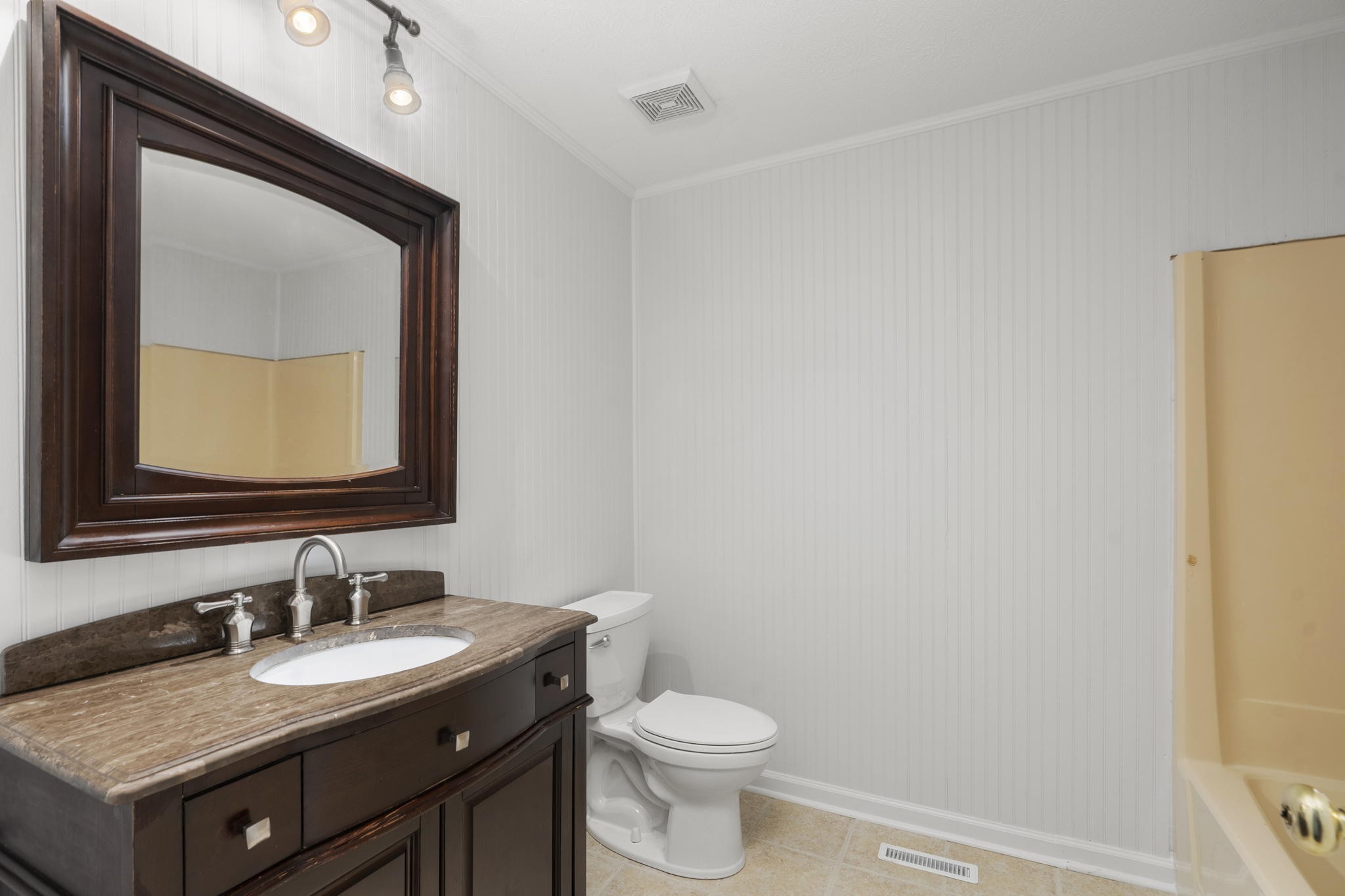 450 Fowler Ford Road Portland, TN 37148 - Photo 11 of 20 a bathroom with a granite countertop sink vanity mirror and toilet