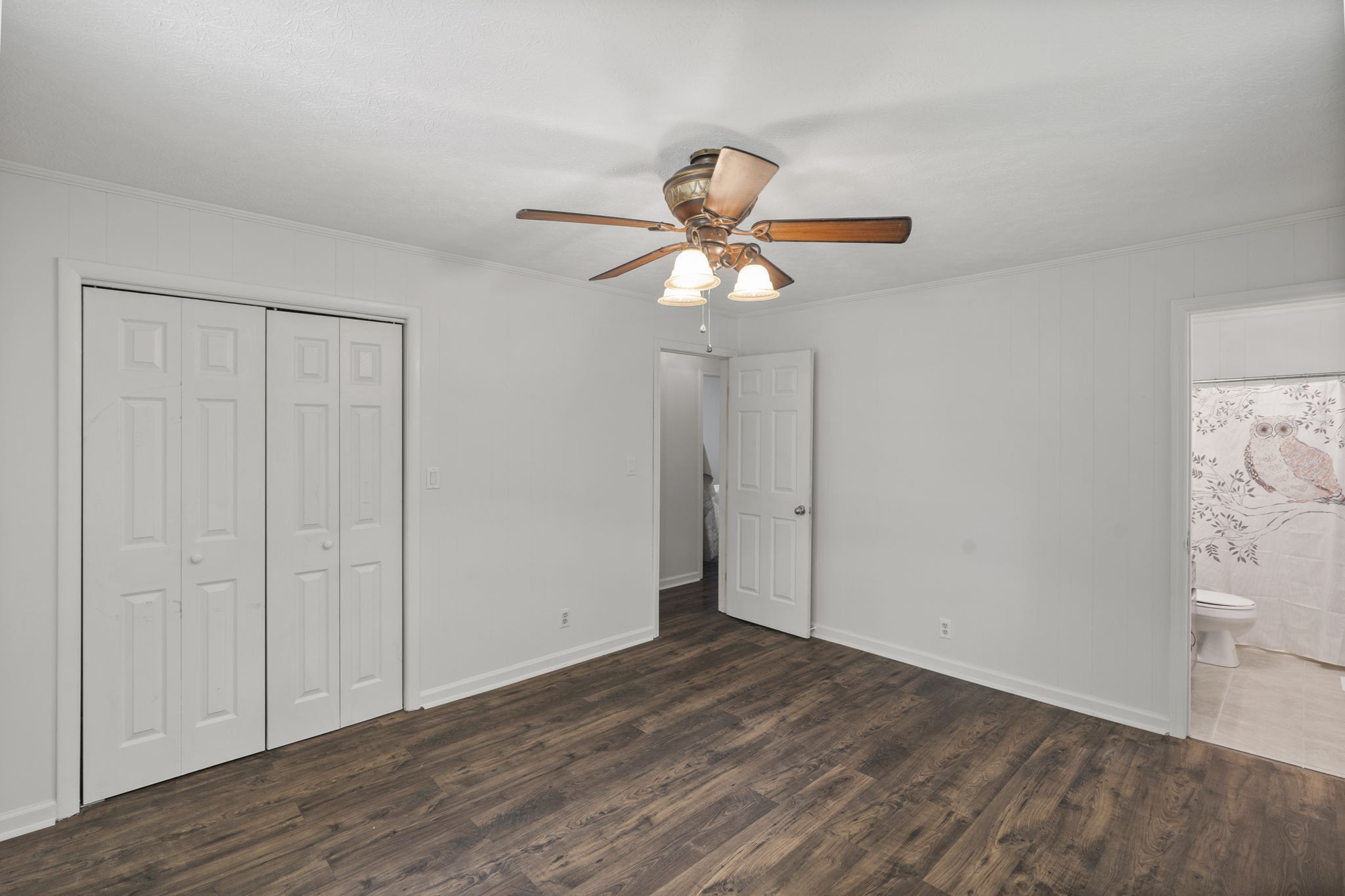 450 Fowler Ford Road Portland, TN 37148 - Photo 12 of 20 a view of an empty room with a window and wooden floor