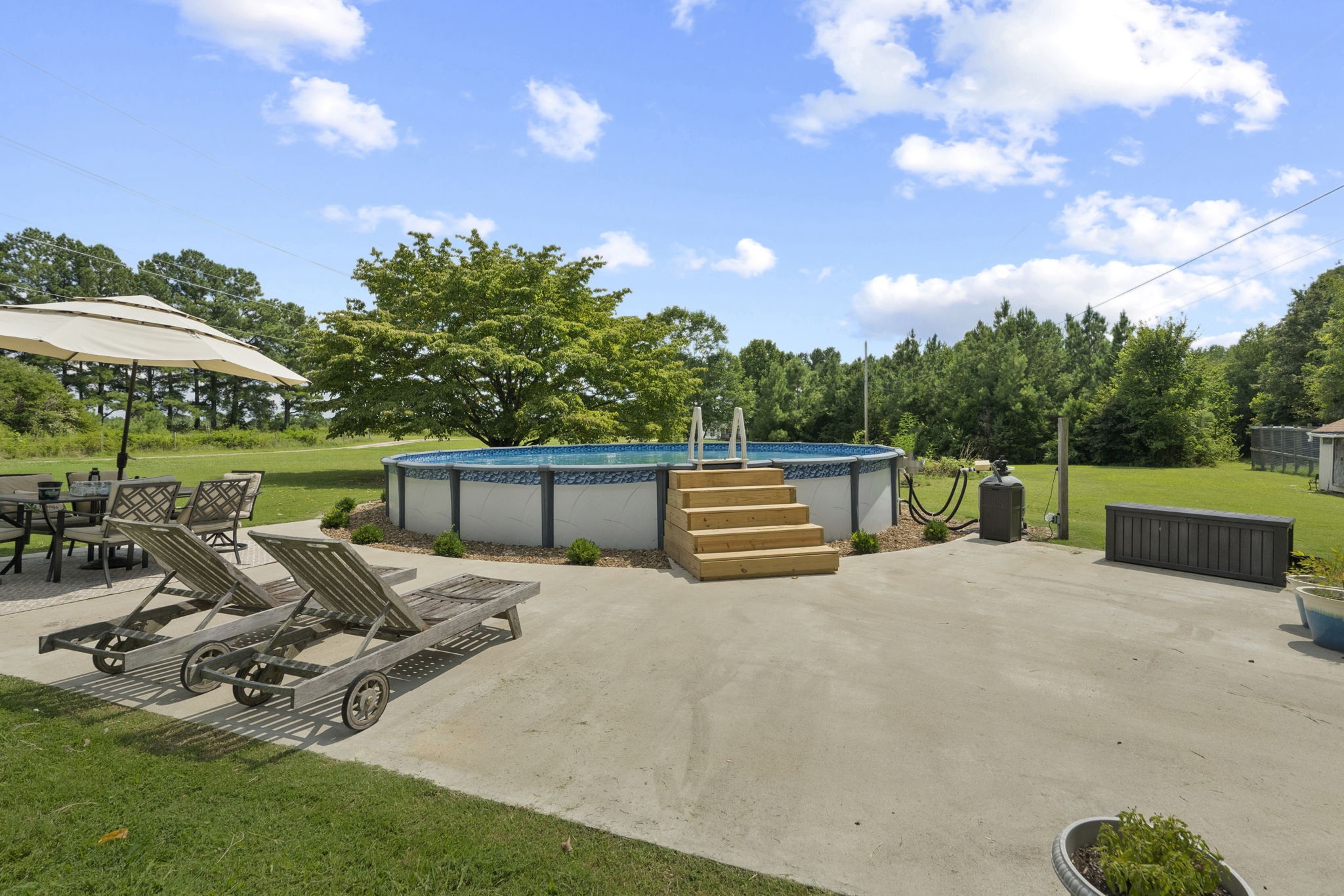 450 Fowler Ford Road Portland, TN 37148 - Photo 19 of 20 a view of a swimming pool with a patio and a garden