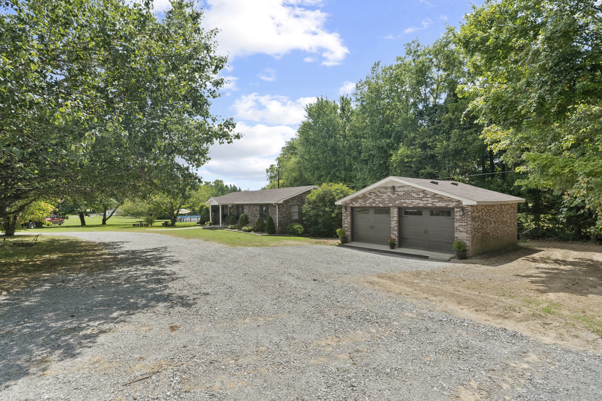 450 Fowler Ford Road Portland, TN 37148 - Photo 20 of 20 a front view of a house with a yard and trees