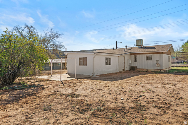 49 600 North Hurricane, UT 84737 - Photo 30 of 33 Back of property with a patio and roof with shingles
