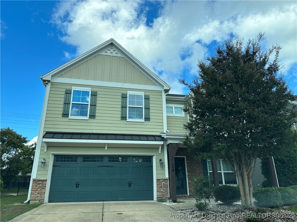 1024 Micahs Way North Spring Lake, NC 28390 - Photo 1 of 43 a front view of a house with a garden
