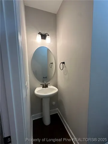a bathroom with a sink and mirror