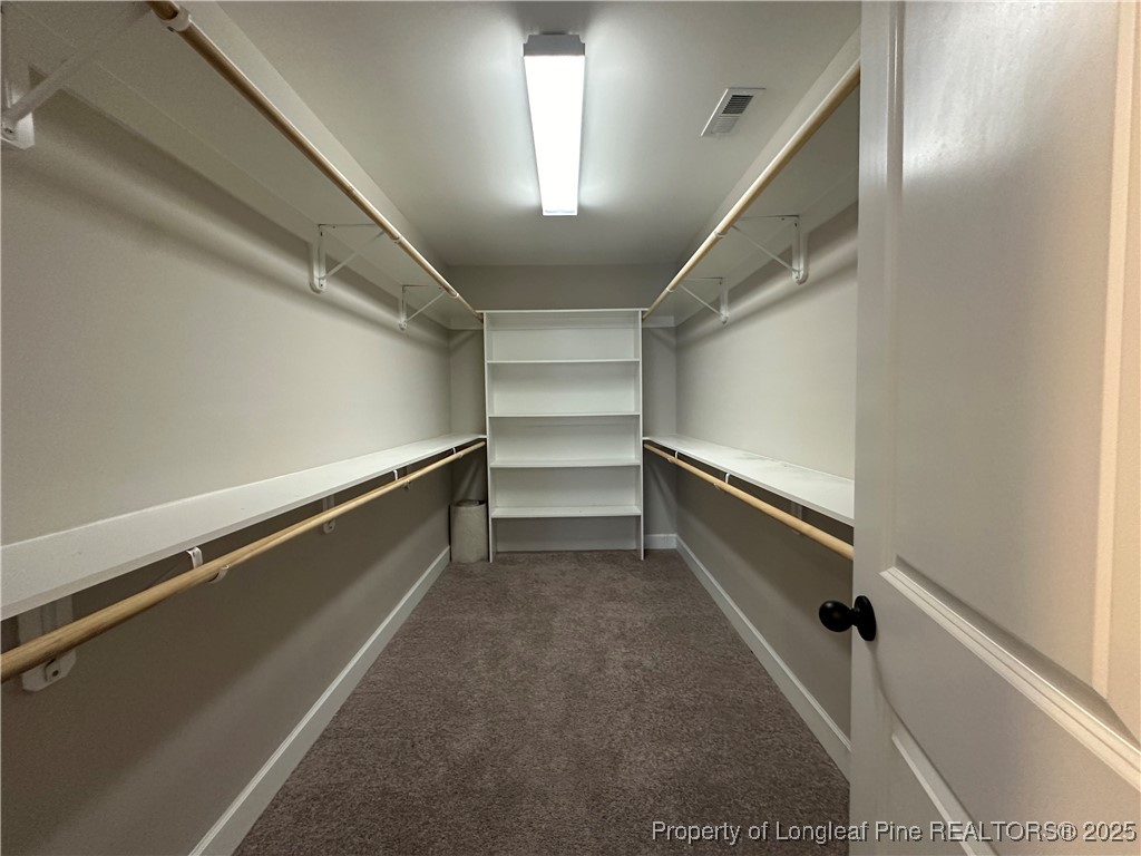 1024 Micahs Way North Spring Lake, NC 28390 - Photo 33 of 43 a storage room with empty racks