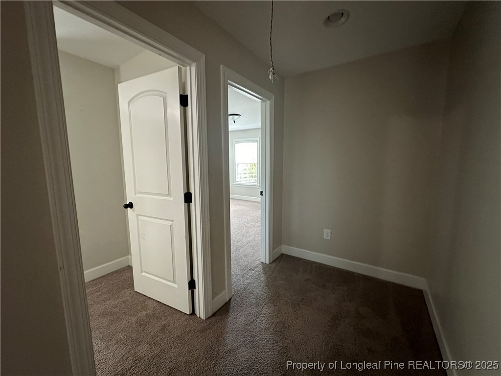 1024 Micahs Way North Spring Lake, NC 28390 - Photo 35 of 43 a view of a hallway with wooden floor