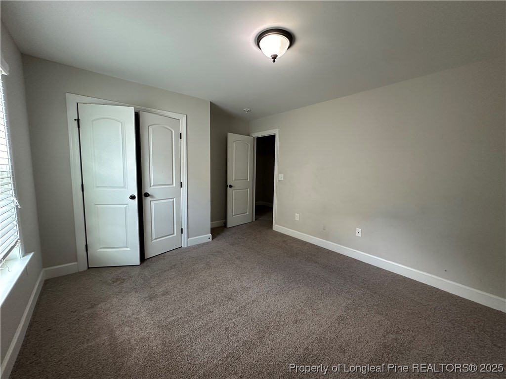 1024 Micahs Way North Spring Lake, NC 28390 - Photo 36 of 43 an empty room with closet and windows