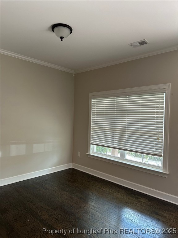 1024 Micahs Way North Spring Lake, NC 28390 - Photo 4 of 43 a view of an empty room with wooden floor and a window