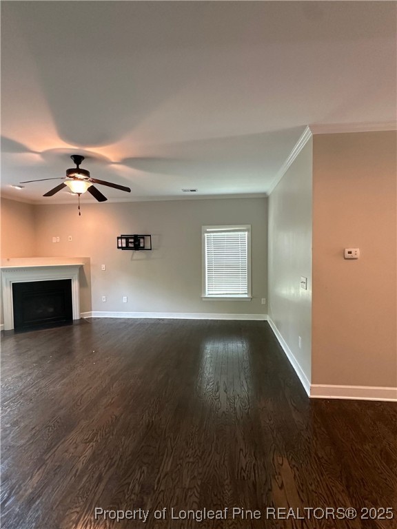1024 Micahs Way North Spring Lake, NC 28390 - Photo 9 of 43 an empty room with wooden floor fireplace and windows