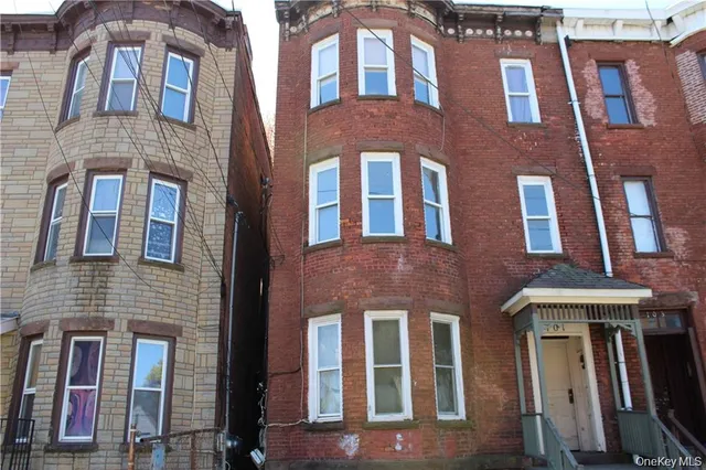 a front view of a multi story residential apartment building