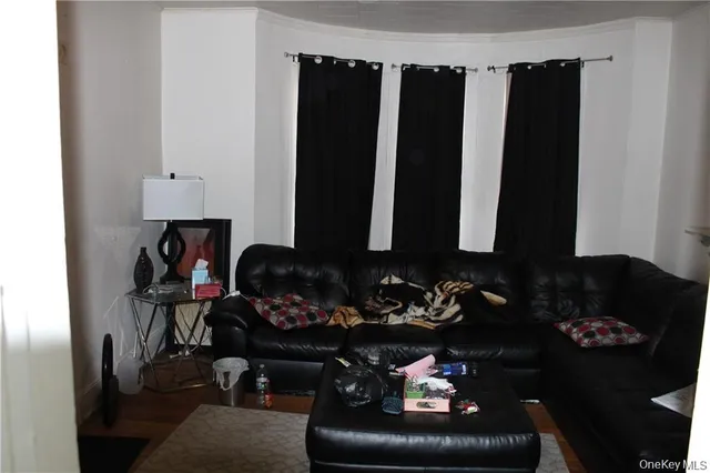 a living room with furniture lamp and rug