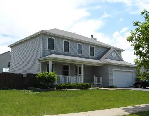 1910 Olde Mill Road Plainfield, IL 60586 - Photo 1 of 1 a front view of a house with a garden and yard