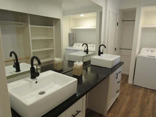 a bathroom with a sink and mirror