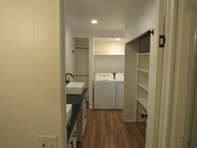 a bathroom with a glass shower door