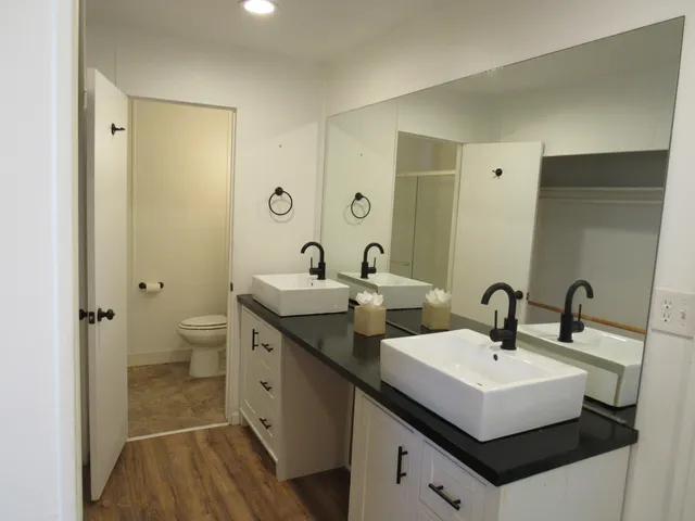 a bathroom with a toilet and a sink