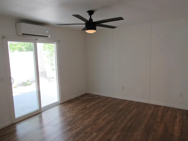 a bathroom with a granite countertop toilet and a shower