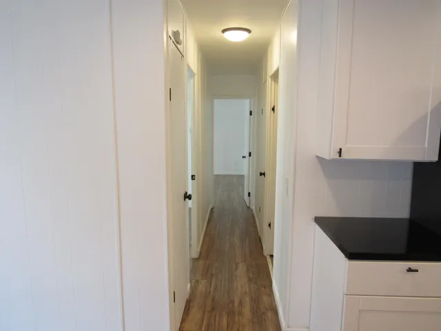 a kitchen with stainless steel appliances a refrigerator sink and cabinets