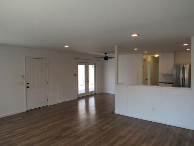 a view of walk in closet with clothes