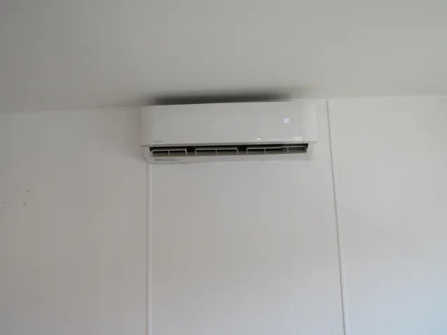 a kitchen with stainless steel appliances granite countertop a stove a sink and a granite counter tops with wooden floors