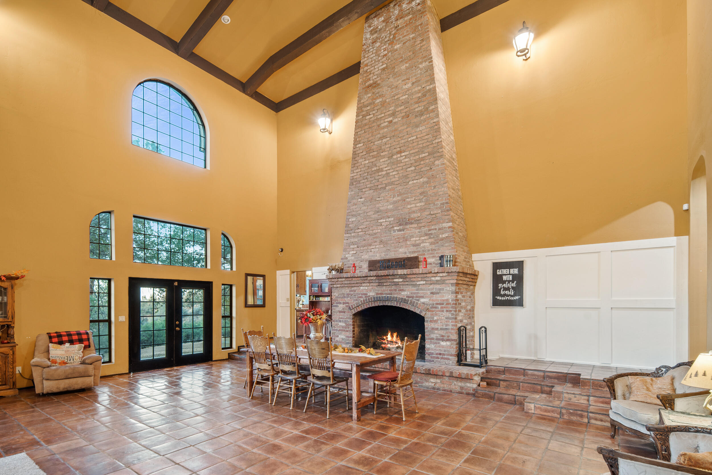 20718 Darsy Road Tehachapi, CA 93561 - Photo 11 of 64 a view of a patio with a fireplace and a couch