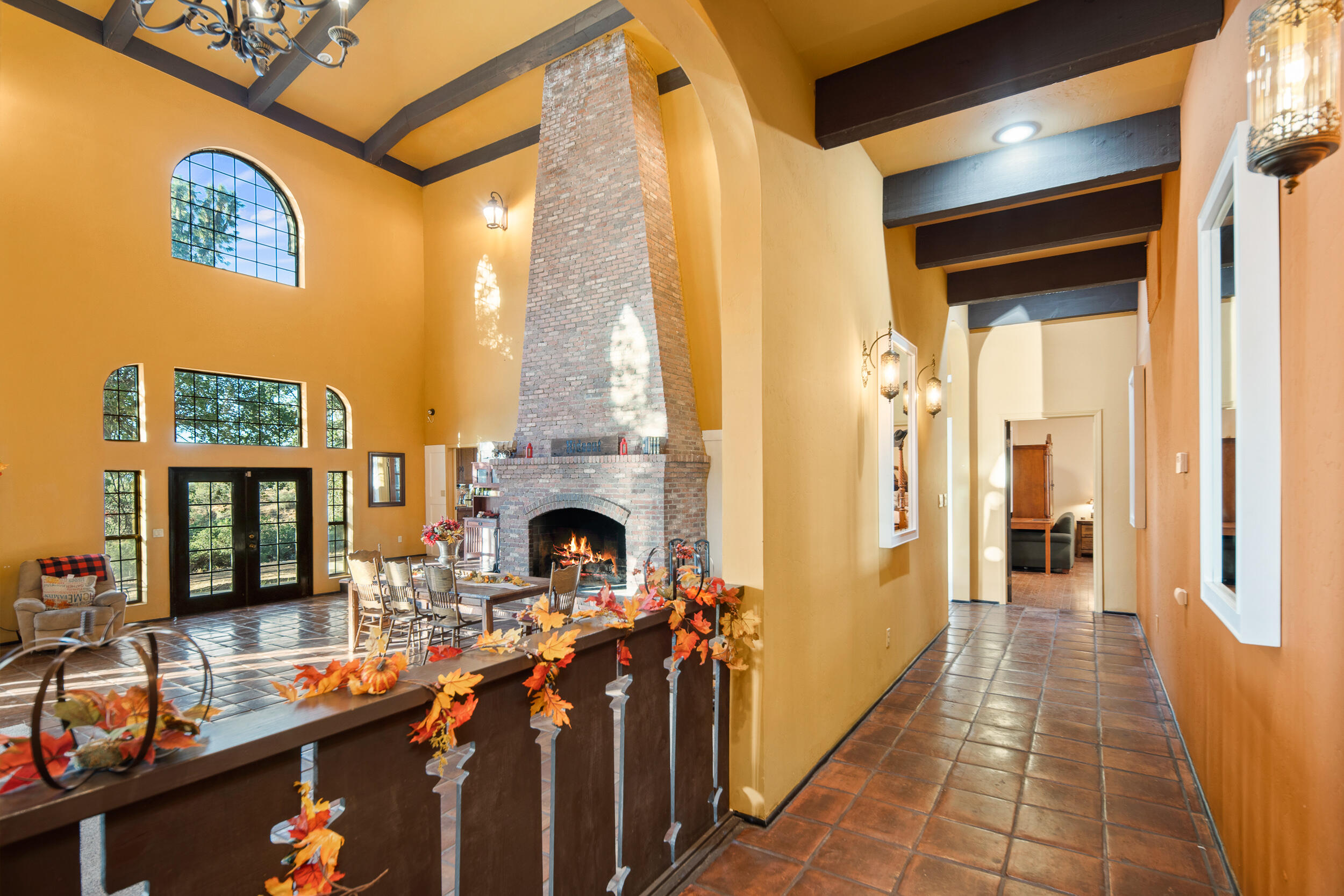 20718 Darsy Road Tehachapi, CA 93561 - Photo 24 of 64 a living room with furniture a fireplace and a floor to ceiling window