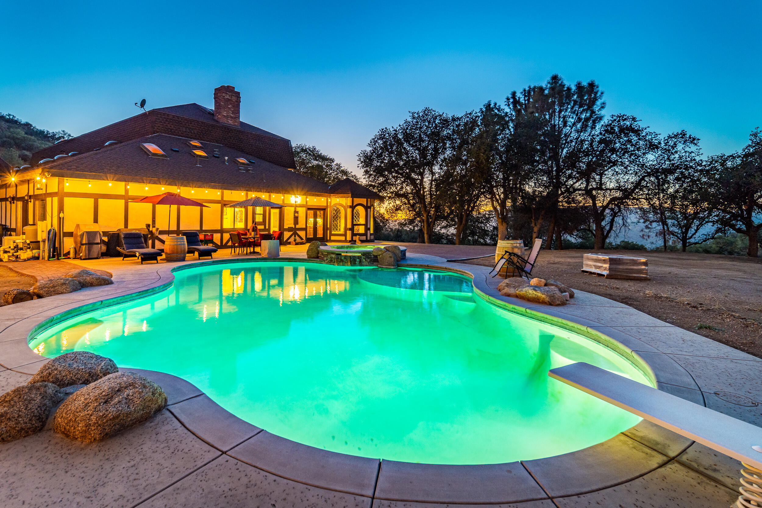 20718 Darsy Road Tehachapi, CA 93561 - Photo 3 of 64 a view of a swimming pool with a patio and a yard