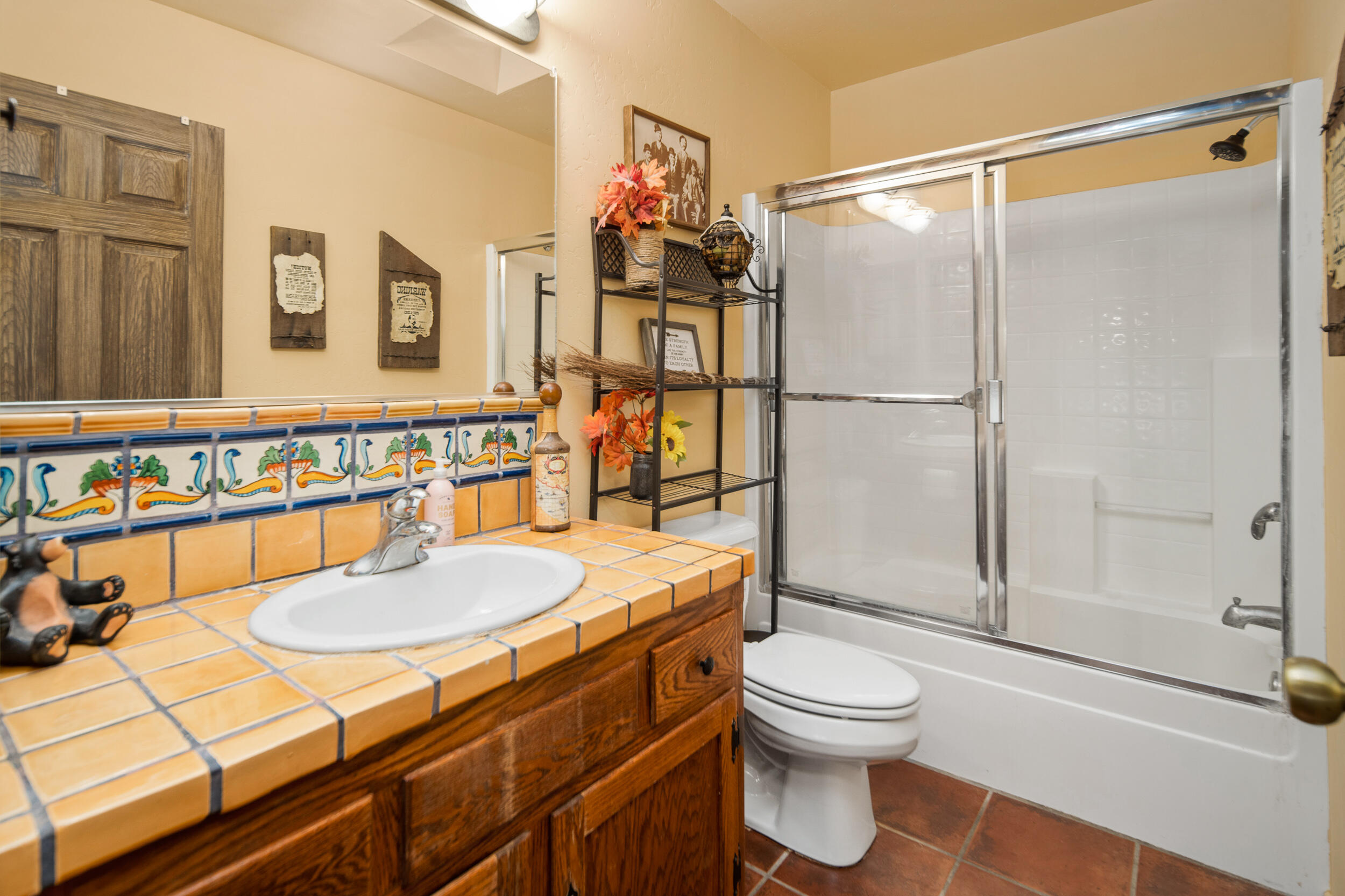 20718 Darsy Road Tehachapi, CA 93561 - Photo 40 of 64 a bathroom with a sink a toilet and shower