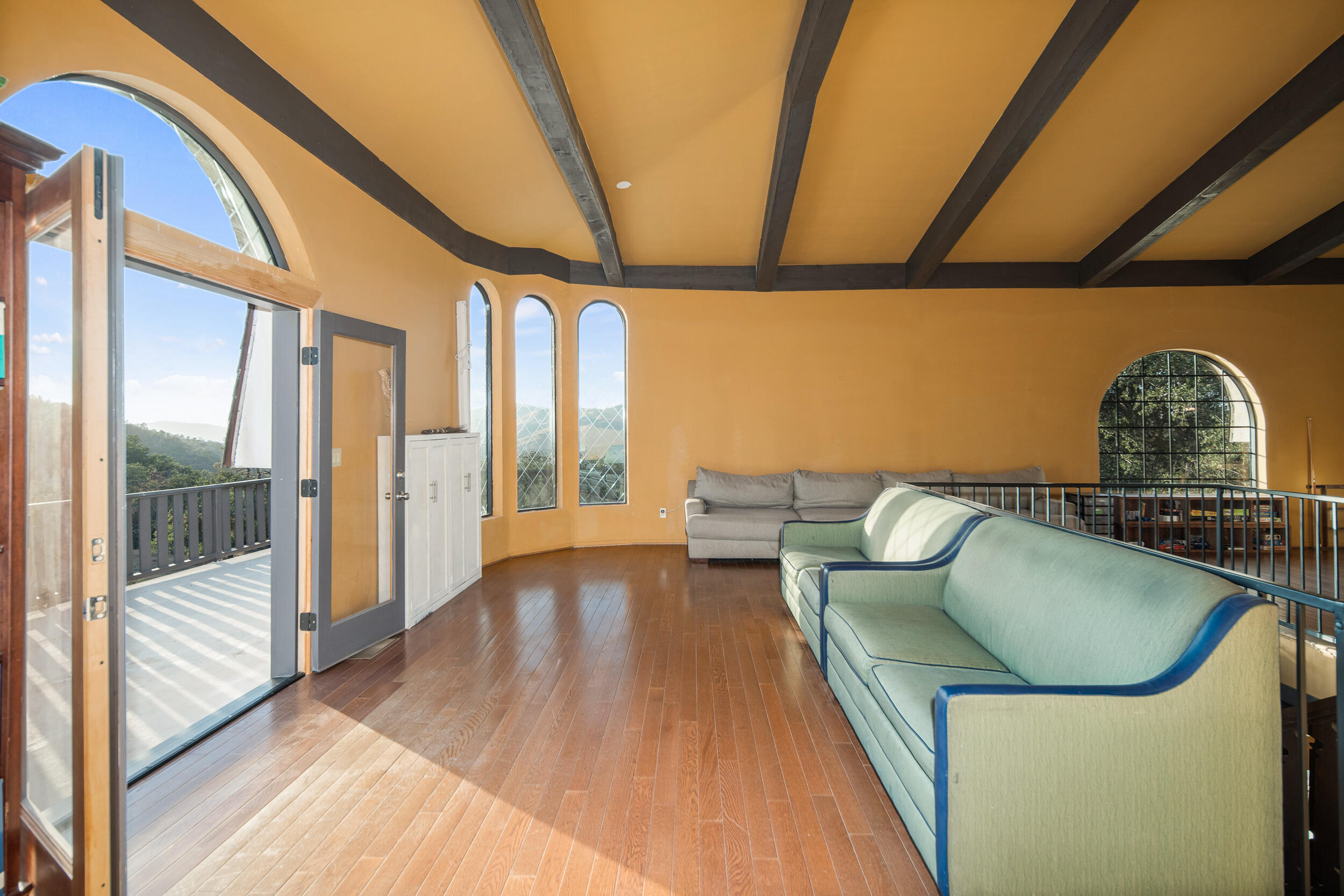 20718 Darsy Road Tehachapi, CA 93561 - Photo 41 of 64 a living room with furniture and a floor to ceiling window