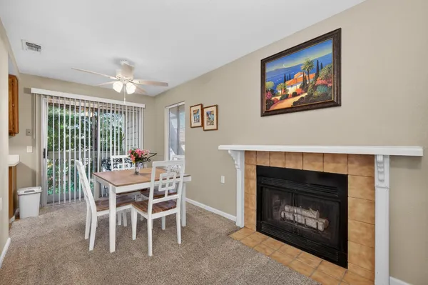 a view of a livingroom with furniture and a fireplace